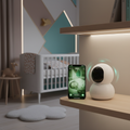 Smart indoor PTZ security camera monitoring baby in nursery with smartphone showing live feed in UAE home