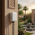 Smart outdoor weatherproof WiFi plug on UAE villa exterior wall controlling garden lights and water pump